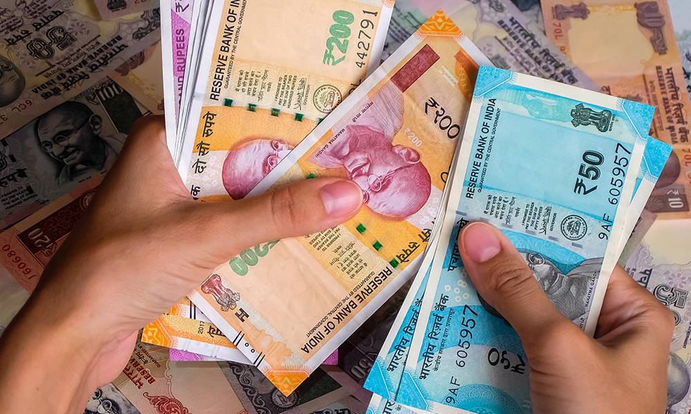 Traveler carrying Indian rupee cash during an Andaman trip